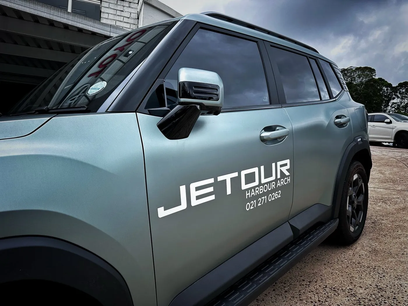 JETOUR vehicle branding decal on SUV door