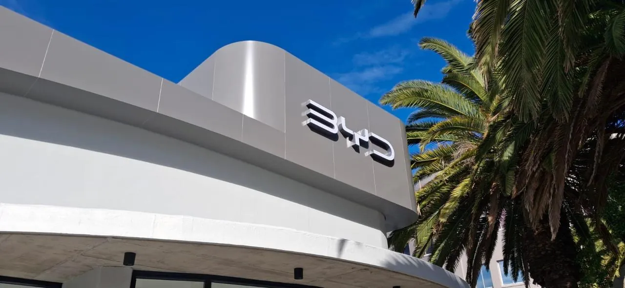 Close-up of illuminated BYD dealership signage