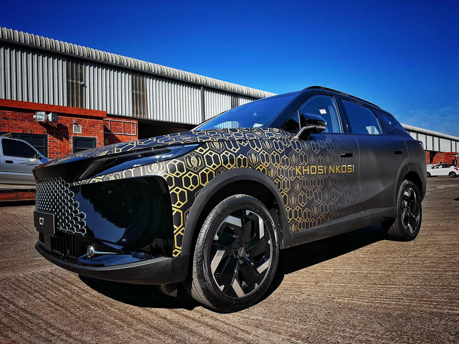 Full vehicle wrap with gold geometric pattern on SUV, Khosi Nkosi branding